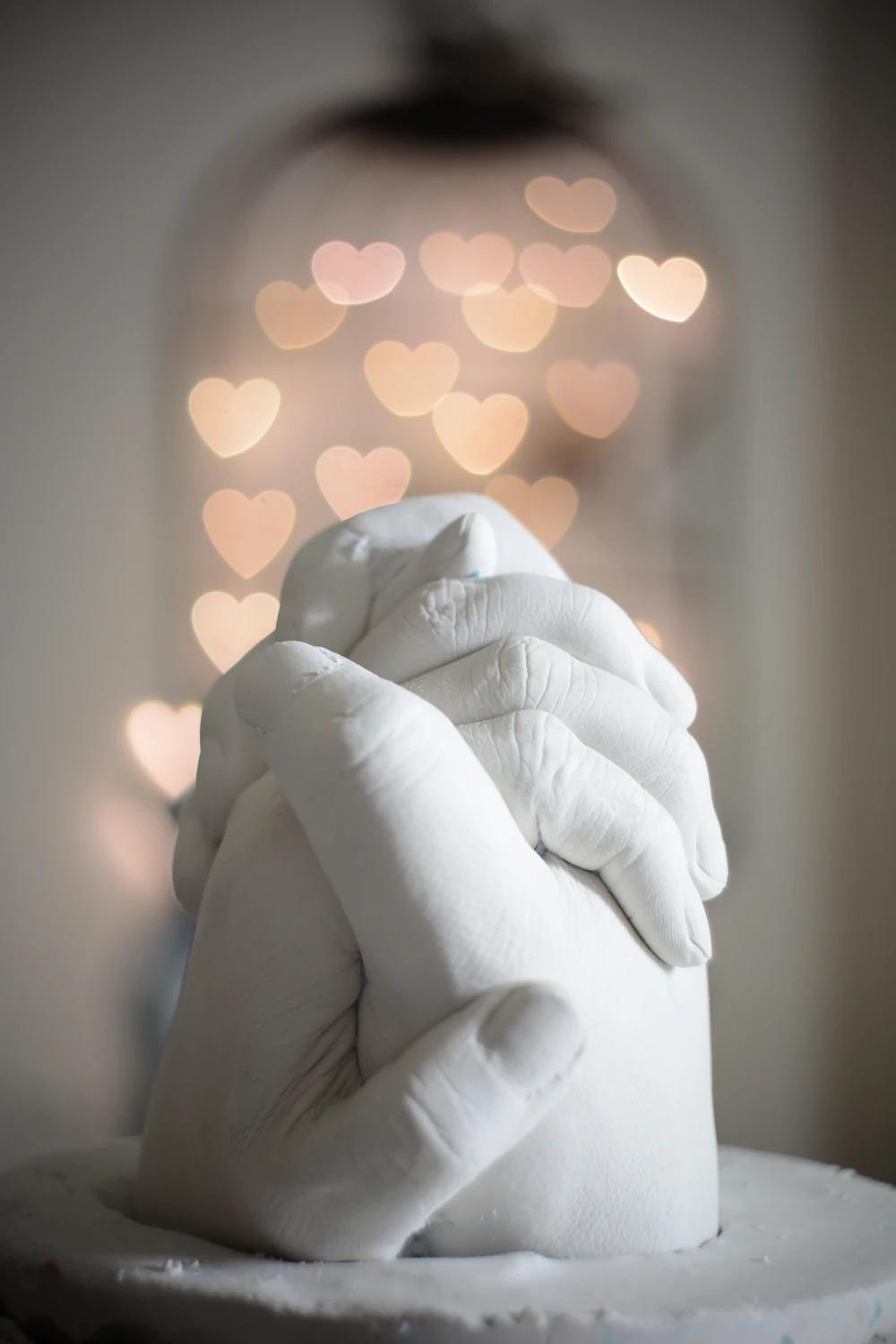 selective focus of holding hands figurine